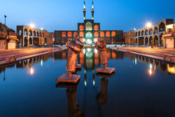  A view of three-story Amir Chakhmaq Complex with a scenic pool in the front, Yazd, central Iran.