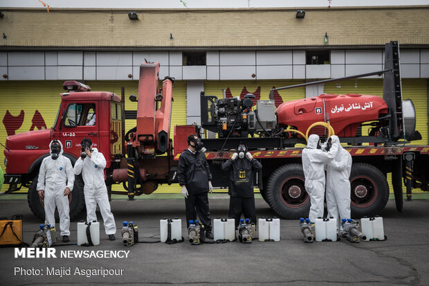 Disinfecting one of Tehran’s neighborhoods against COVID-19