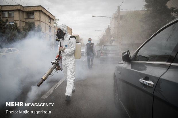 Disinfecting one of Tehran’s neighborhoods against COVID-19