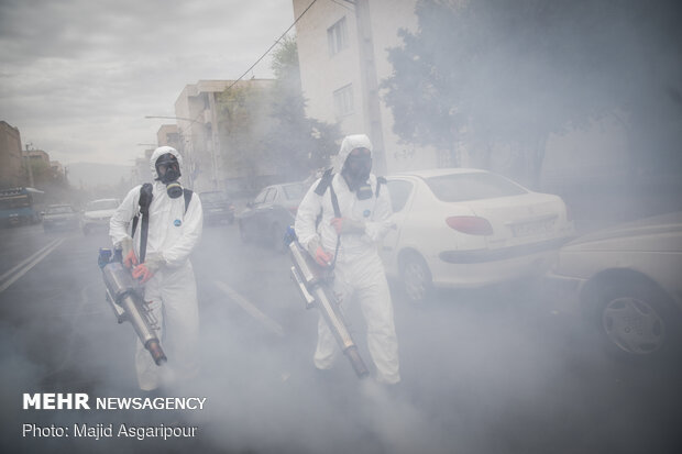 Disinfecting one of Tehran’s neighborhoods against COVID-19