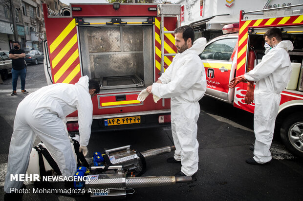 Firefighters disinfecting a neighborhood in S Tehran