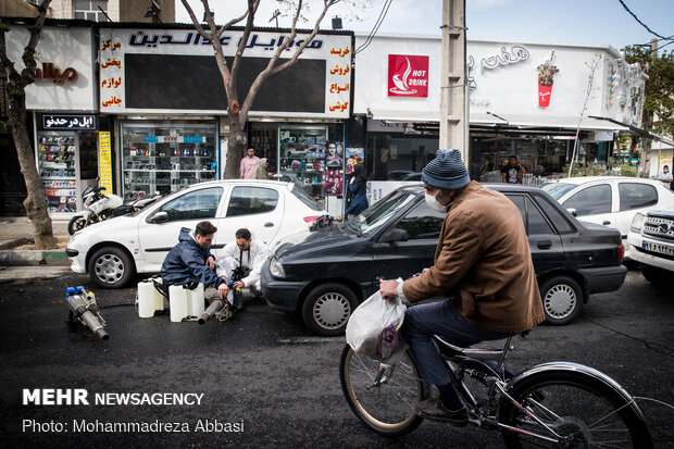 Firefighters disinfecting a neighborhood in S Tehran