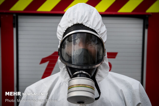 Firefighters disinfecting a neighborhood in S Tehran