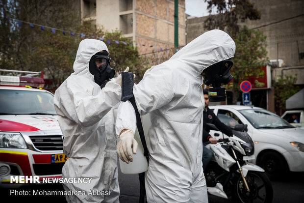 Firefighters disinfecting a neighborhood in S Tehran