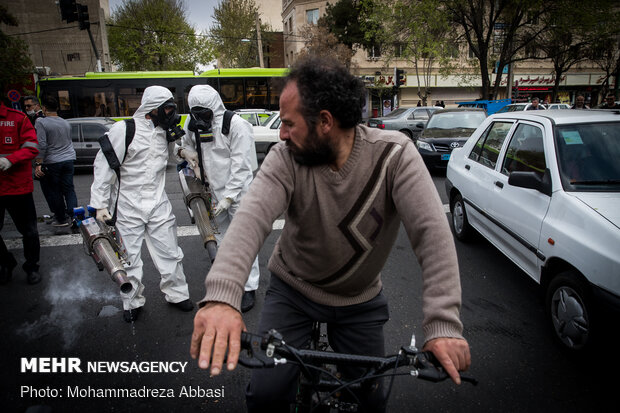 Firefighters disinfecting a neighborhood in S Tehran