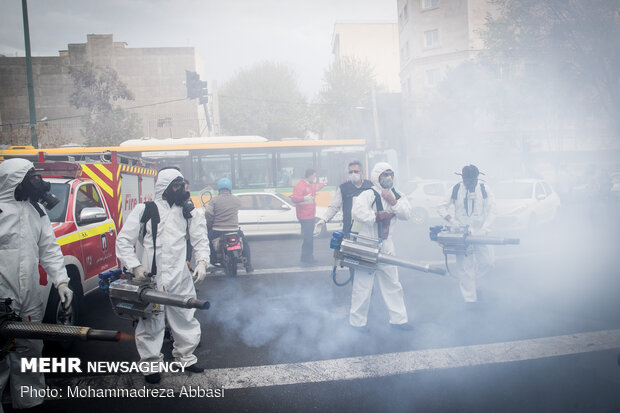 Firefighters disinfecting a neighborhood in S Tehran