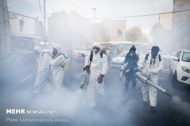 Firefighters disinfecting a neighborhood in S Tehran