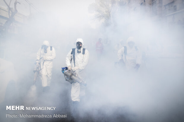 Firefighters disinfecting a neighborhood in S Tehran