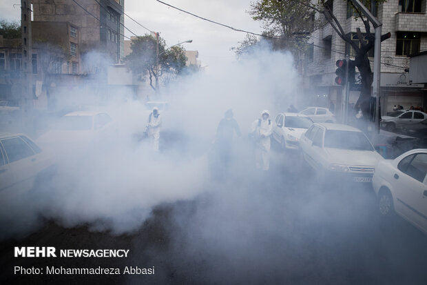 Firefighters disinfecting a neighborhood in S Tehran