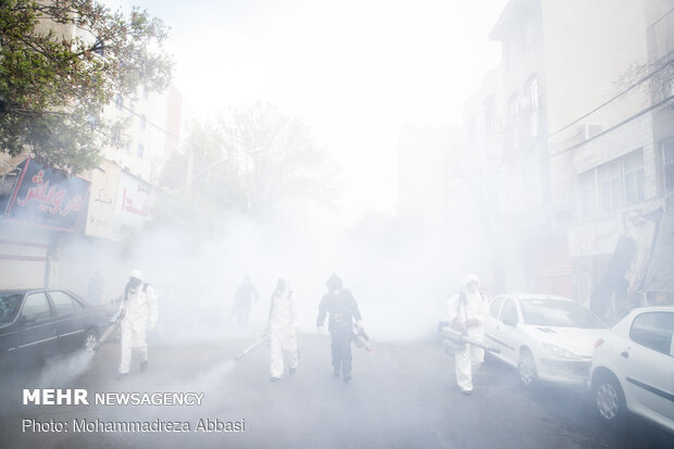 Firefighters disinfecting a neighborhood in S Tehran