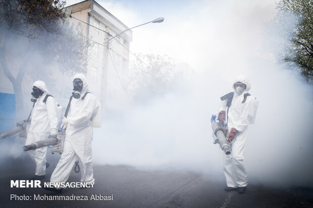 Firefighters disinfecting a neighborhood in S Tehran