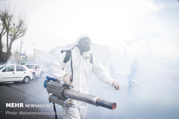 Firefighters disinfecting a neighborhood in S Tehran