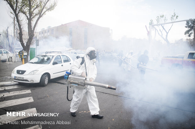 Firefighters disinfecting a neighborhood in S Tehran