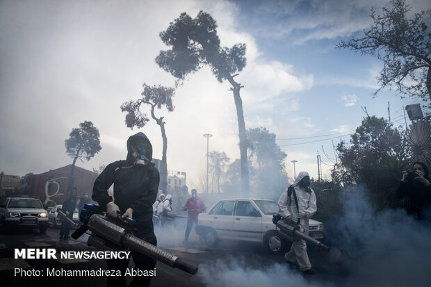 Firefighters disinfecting a neighborhood in S Tehran