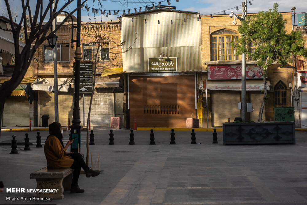 A woman sat on a bench near a bazaar in Shiraz on March 19.