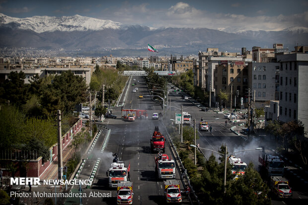 Firefighters disinfecting a neighborhood in E Tehran
