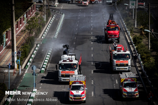 Firefighters disinfecting a neighborhood in E Tehran
