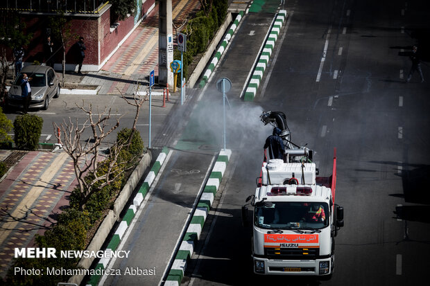 Firefighters disinfecting a neighborhood in E Tehran
