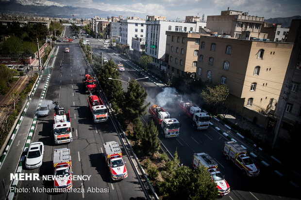 Firefighters disinfecting a neighborhood in E Tehran
