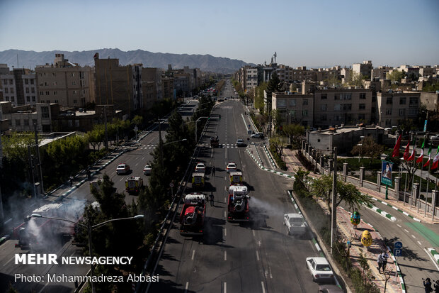 Firefighters disinfecting a neighborhood in E Tehran
