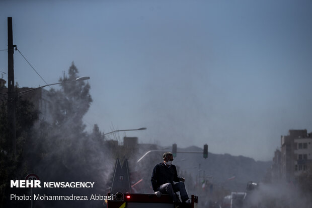 Firefighters disinfecting a neighborhood in E Tehran
