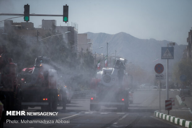 Firefighters disinfecting a neighborhood in E Tehran
