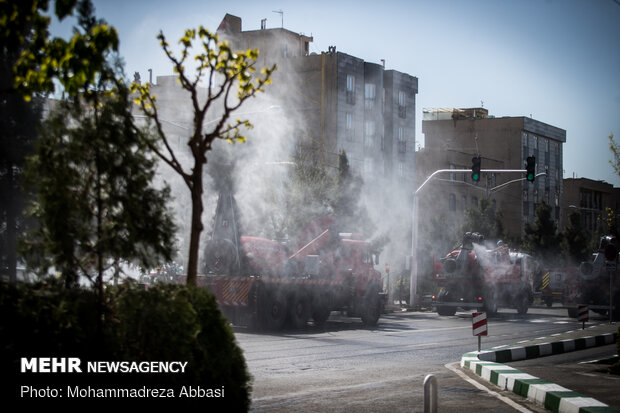 Firefighters disinfecting a neighborhood in E Tehran
