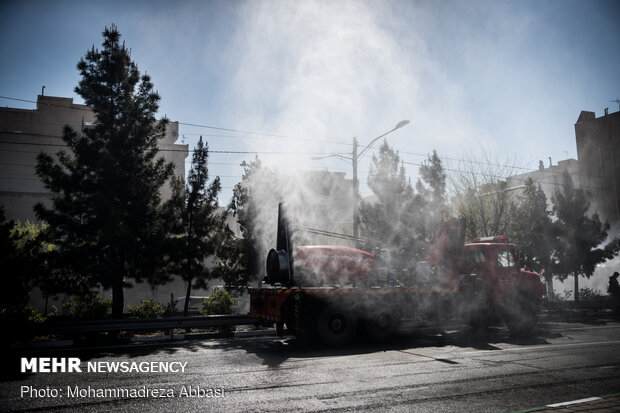 Firefighters disinfecting a neighborhood in E Tehran
