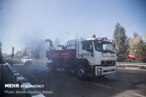 Firefighters disinfecting a neighborhood in E Tehran
