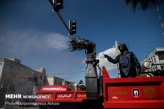 Firefighters disinfecting a neighborhood in E Tehran
