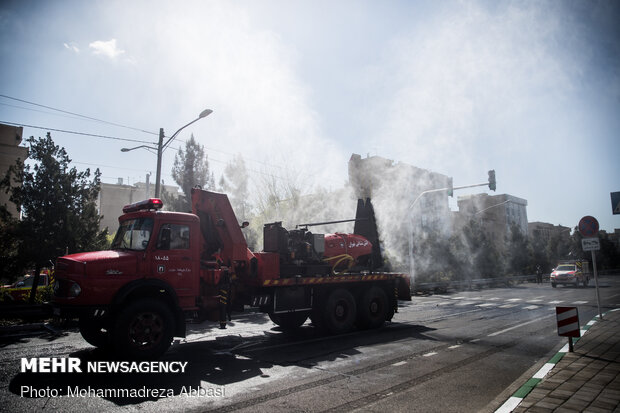 Firefighters disinfecting a neighborhood in E Tehran
