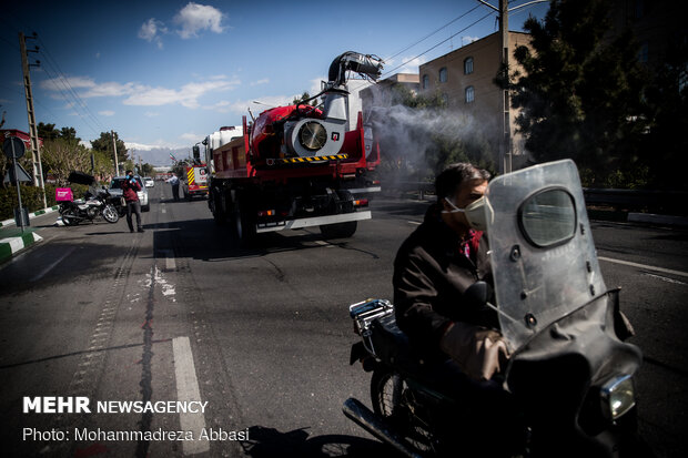 Firefighters disinfecting a neighborhood in E Tehran
