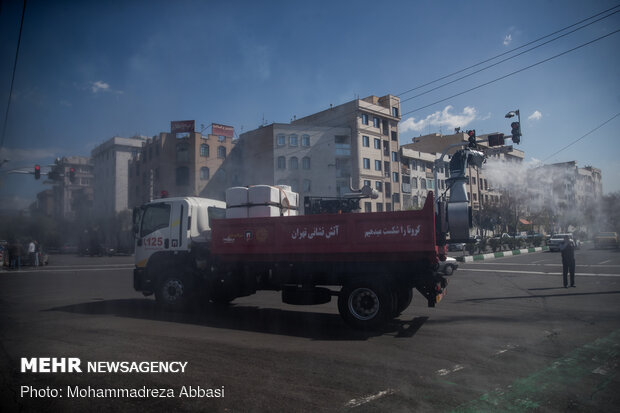 Firefighters disinfecting a neighborhood in E Tehran
