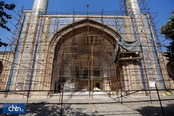  A portico of the Jameh Mosque of Qazvin is seen behind scaffolding in an undated photo.