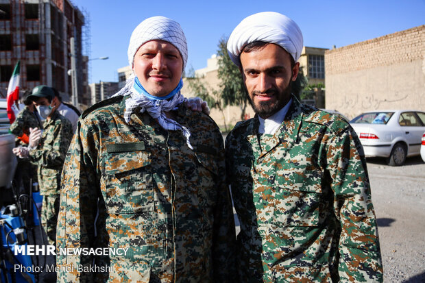 A seminary student from Russia disinfcteing thoroughfares in Qom