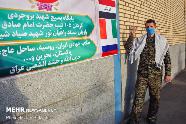 A seminary student from Russia disinfcteing thoroughfares in Qom