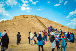 An undated photo depict holidaymakers visiting the prehistorical Ozbaki hill situated near Nazarabad, some 80 km west of Tehran.