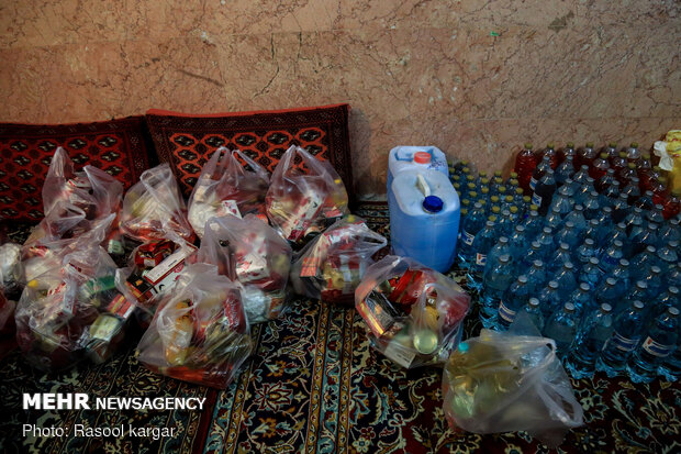 Distributing food supplies to underprivileged families in Mashhad