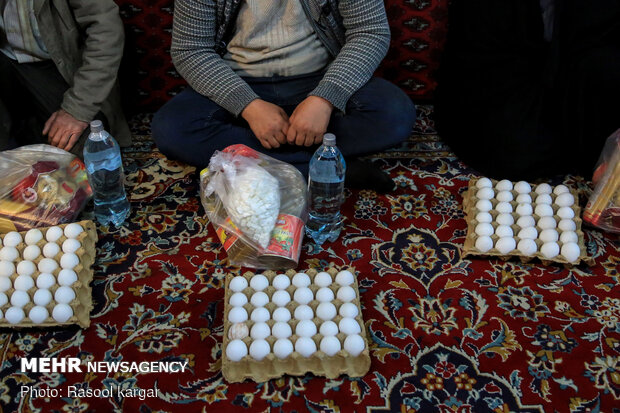 Distributing food supplies to underprivileged families in Mashhad