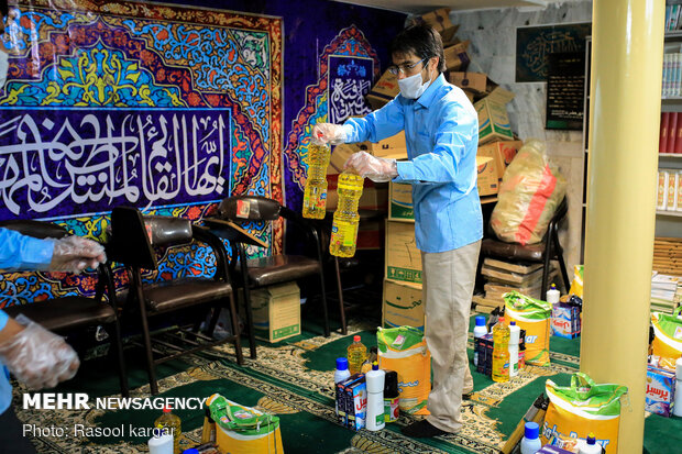 Distributing food supplies to underprivileged families in Mashhad