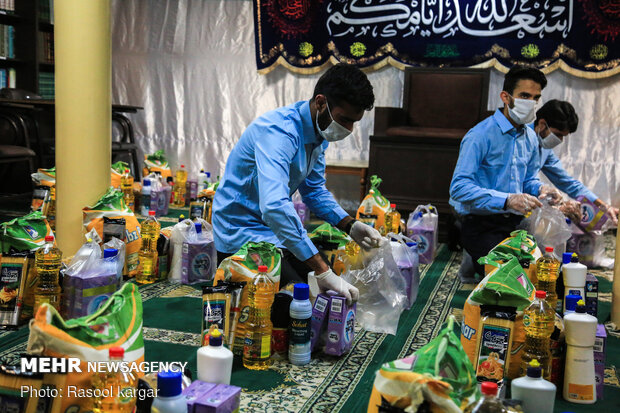 Distributing food supplies to underprivileged families in Mashhad