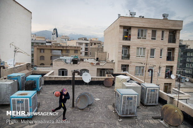 Iranians working out on rooftops amid the pandemic