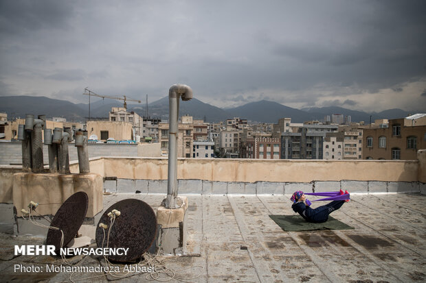 Iranians working out on rooftops amid the pandemic