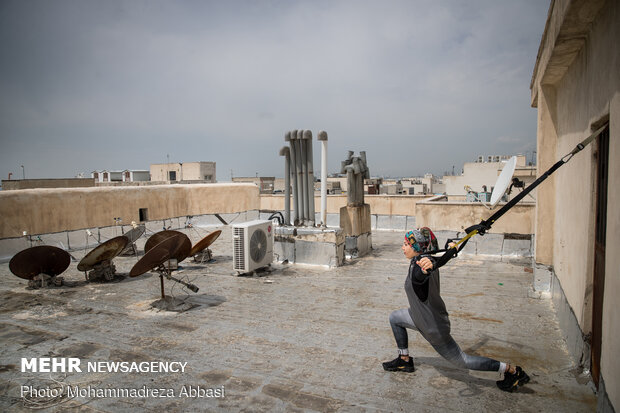 Iranians working out on rooftops amid the pandemic