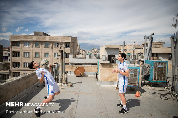 Iranians working out on rooftops amid the pandemic