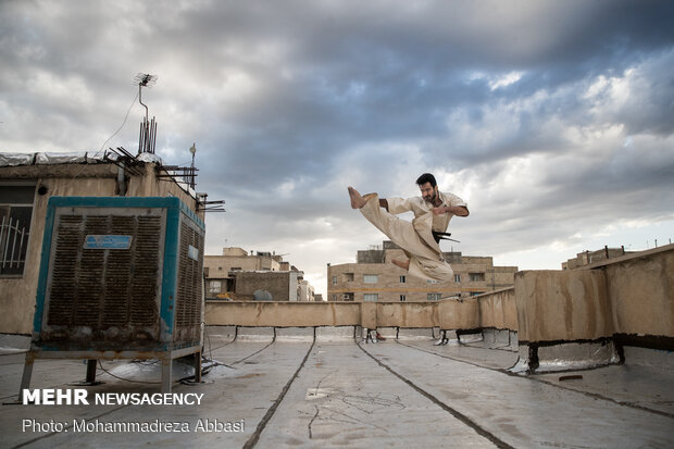 Iranians working out on rooftops amid the pandemic