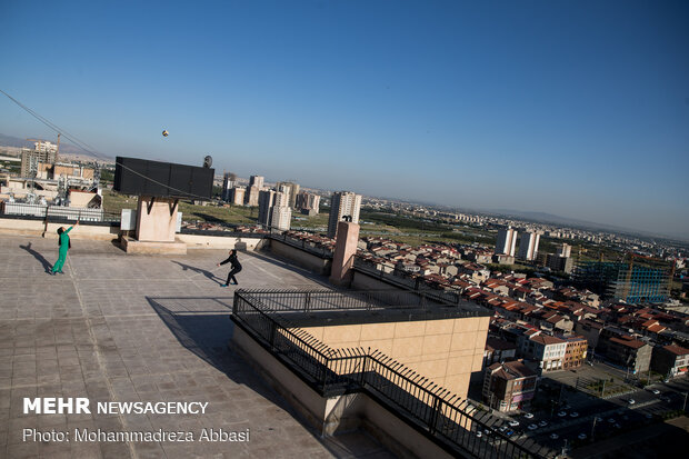 Iranians working out on rooftops amid the pandemic