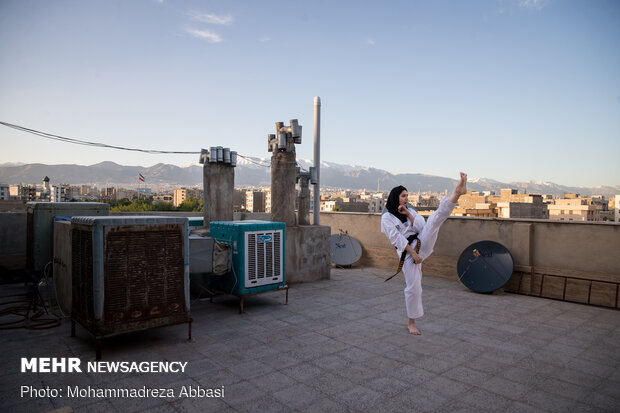 Iranians working out on rooftops amid the pandemic