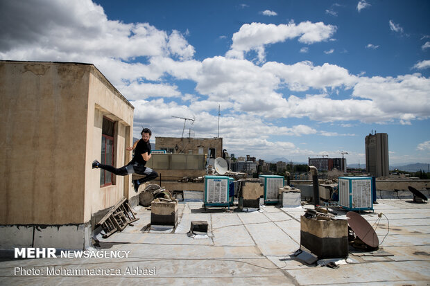 Iranians working out on rooftops amid the pandemic