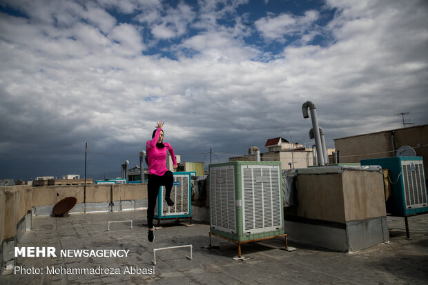 Iranians working out on rooftops amid the pandemic